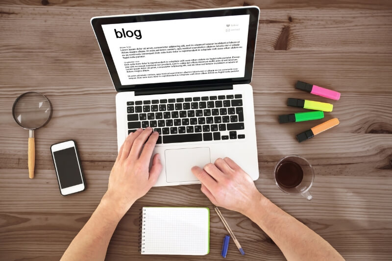 An image of a person writing a blog