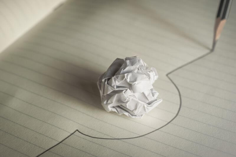 An image of a a folded paper representing common mistakes to avoid in SEO audit.