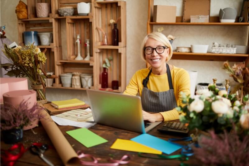 An image of a business owner using SEO service for their local business.