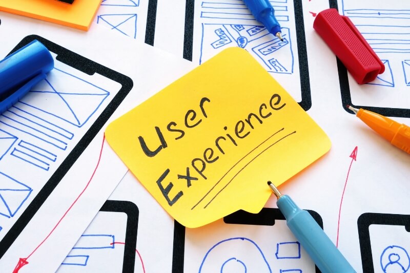 An image of a sticky note with user experience written on it for seo marketing.